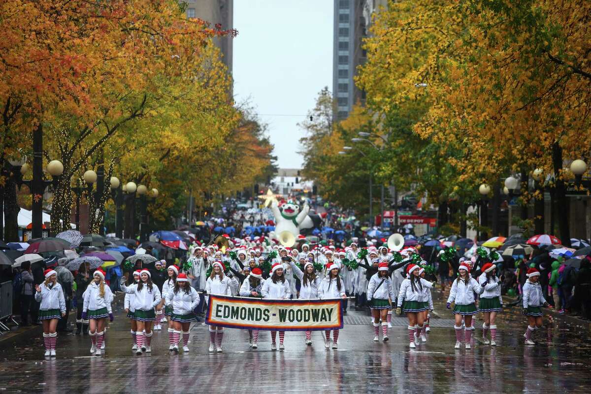 Students from Edmonds-Woodway march along 4th Avenue during the Macy's Holiday Parade in Seattle on Friday, November 28, 2014. It rained on the parade but that didn't stop thousands of people from coming out the watch the annual event.