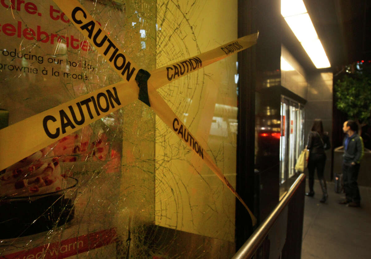 A broken window at Macy’s Union Square is taped after a protest turned violent Friday night.