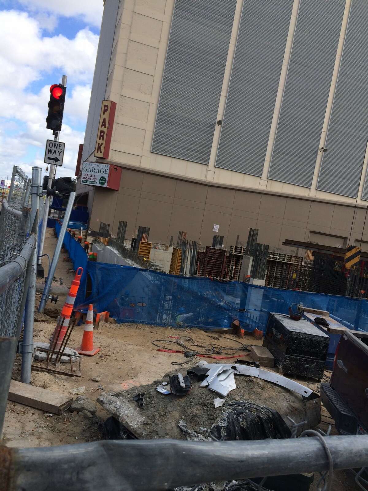 Parts from a pickup truck are shown after the vehicle drove into a downtown construction site.