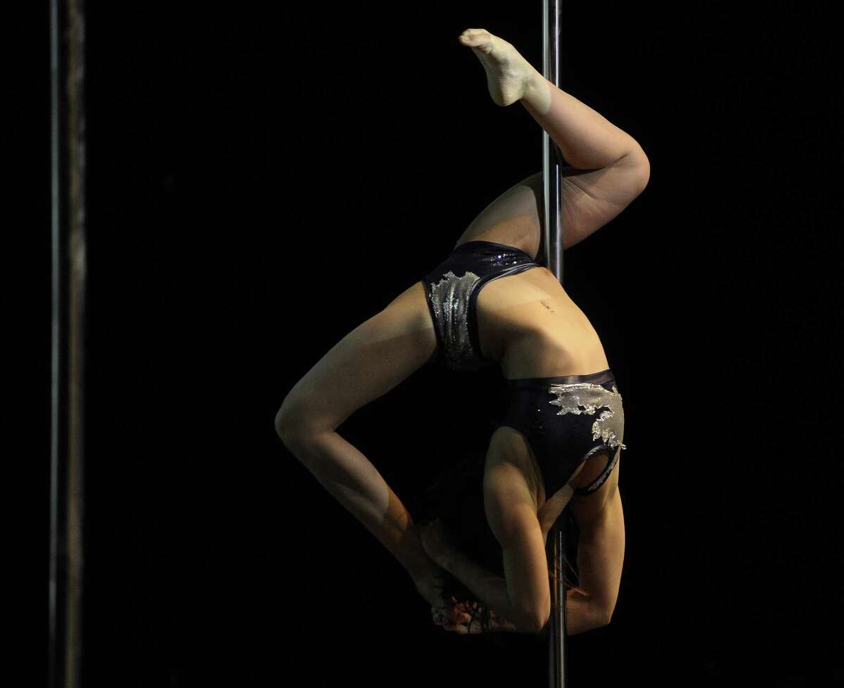 Brazilian pole dancer Alessandra Rancan competes in the South America 2014 Pole Dance competition in Buenos Aires on November 24, 2014. AFP PHOTO / Juan Mabromata