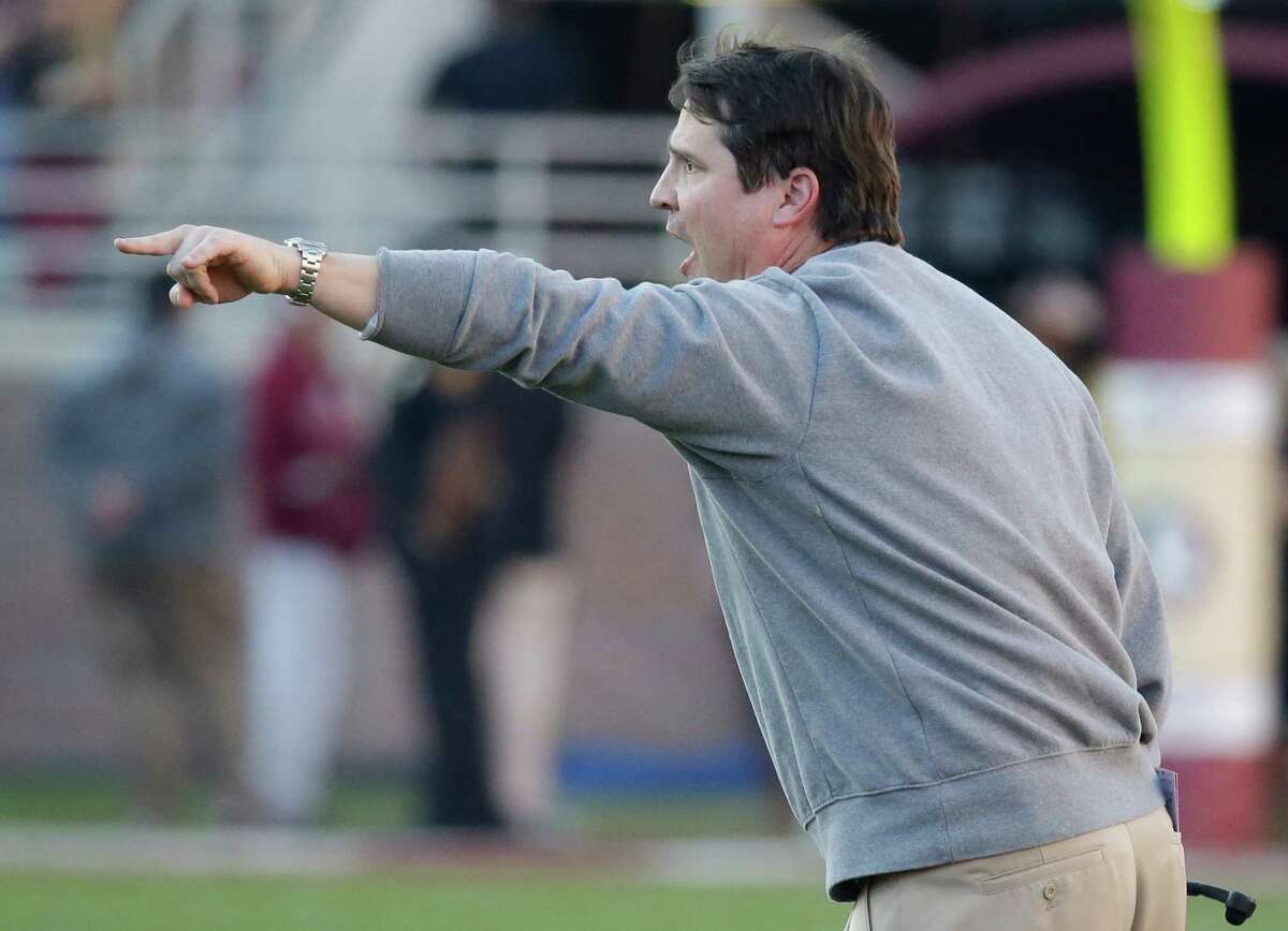Former Florida coach Will Muschamp shouts to his players during the first half against Florida State on Nov. 29. Muschamp is reportedly being targed by both Texas A&M and Auburn for their vacant defensive coordinator positions.