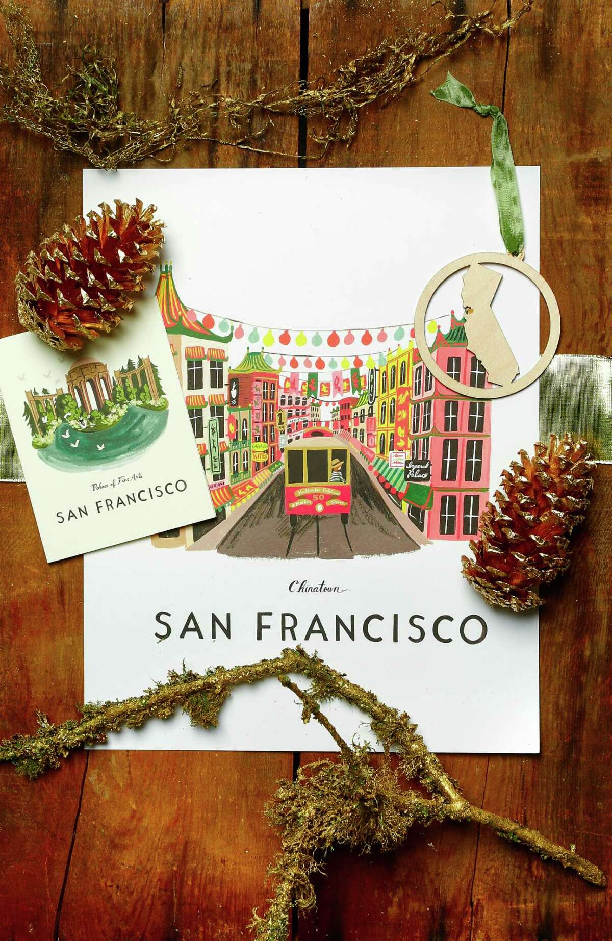 For the LocavoreRifle Paper Co. Palace of Fine Arts box set of 8 cards ($20, right) and Chinatown 11 by 14 poster ($42); Kimball Prints laser-cut CA heart ornament ($14), all at Lavish, 508 Hayes St., www.shoplavish.com