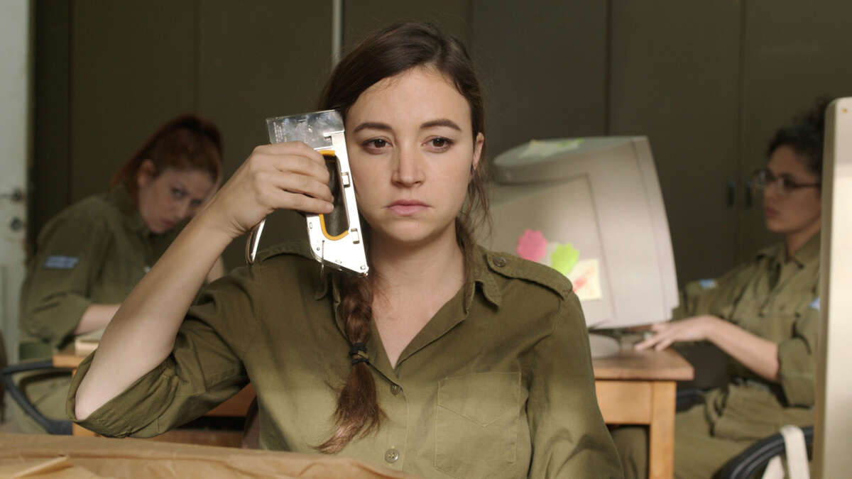 Daffi (Nelly Tagar) can’t stand her life and wants to be transferred from a desert outpost to Tel Aviv in the Israeli comedy “Zero Motivation,” about three women serving their two-year military service.