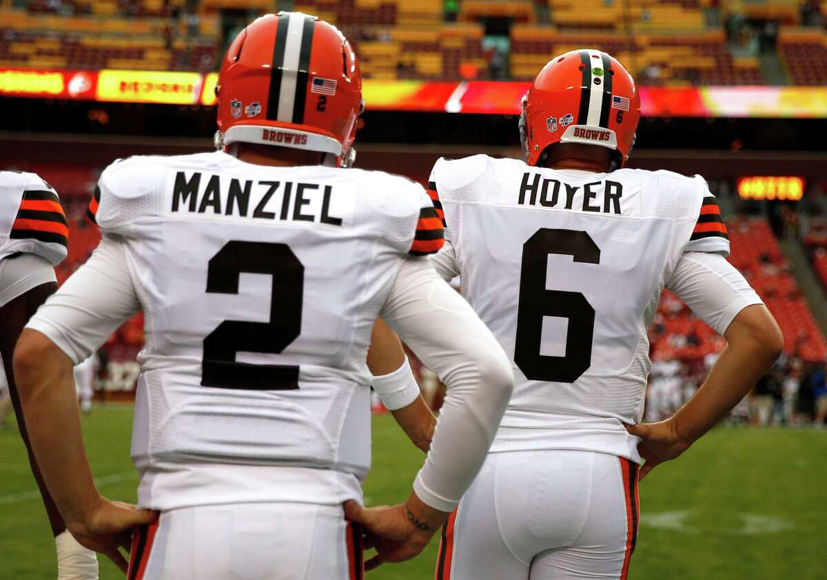 For at least another week, ﻿Johnny Manziel, left, will be appropriately numbered as the Browns' backup quarterback behind Brian Hoyer.