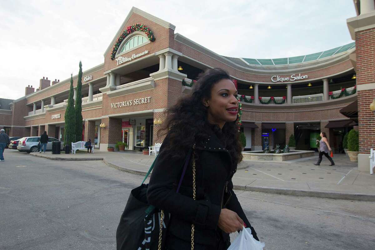 Khaya Laidley walks near the Rice Village Arcade, which is about to get a makeover.