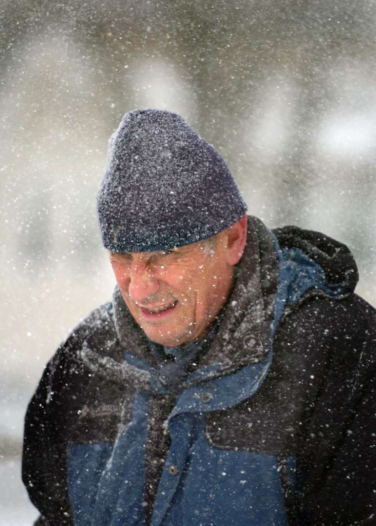 Larry Cramp braves the elements while snowblowing his driveway in Ansonia Friday Feb. 26, 2010.