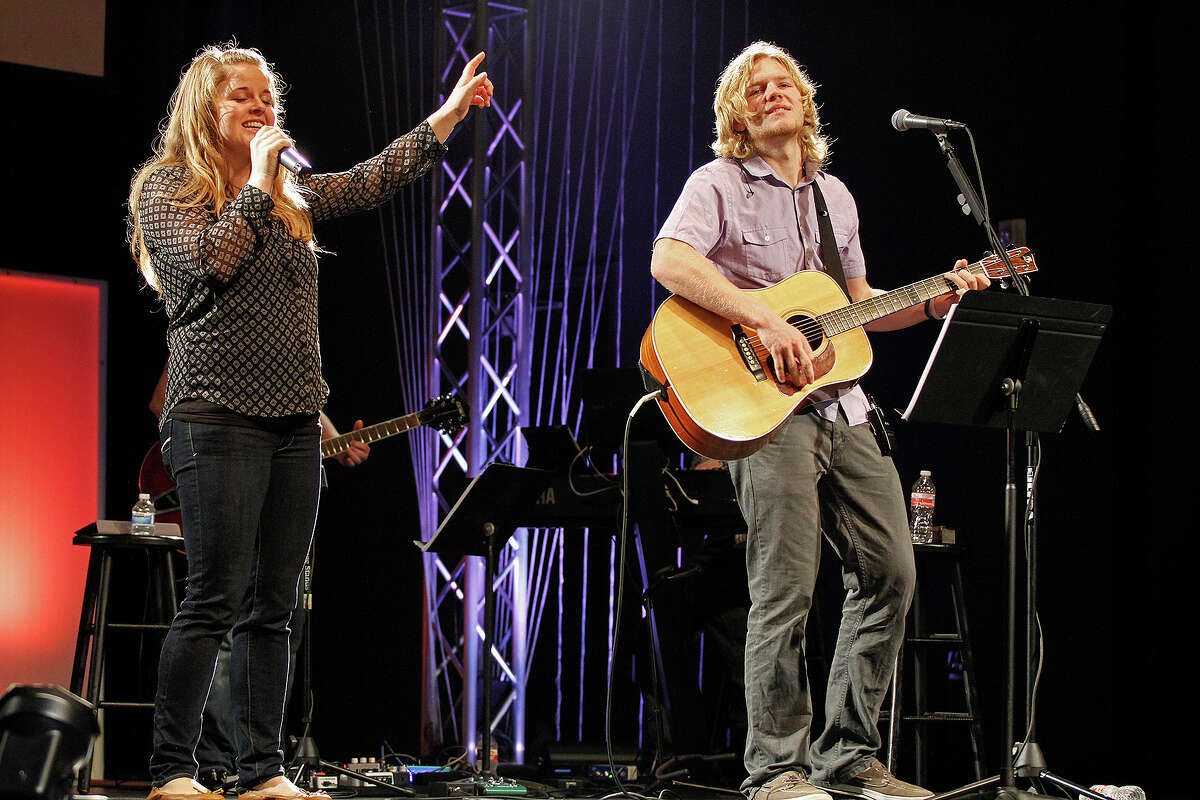 Lauren Shepherd and Ryan Azzaro, Pastor Sean Azzaro's daughter and son, lead a song Sunday, Nov. 30, 2014, at River City Community Church.