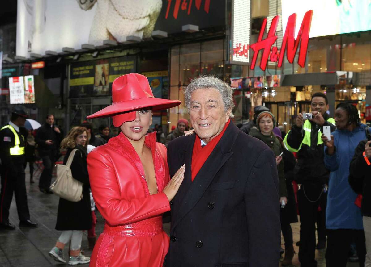 NEW YORK, NY - DECEMBER 03: Lady Gaga and Tony Bennett view the H&M Holiday Campaign at H&M Flagship Store in Times Square on December 3, 2014 in New York City. (Photo by Rob Kim/Getty Images)
