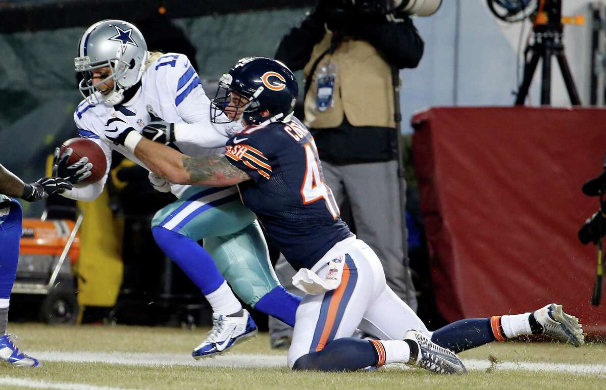 Dallas Cowboys Tony Romo throws a pass out of his own endzone in