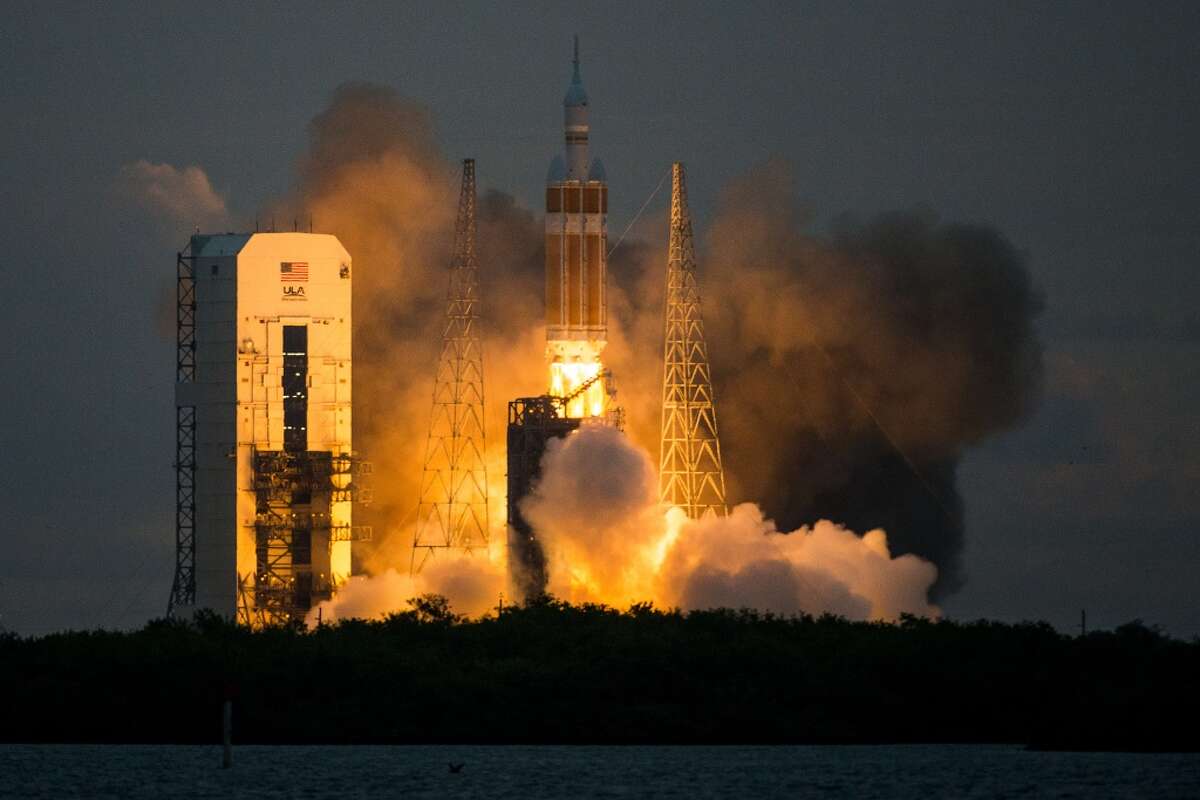 NASA's Orion spacecraft launches atop a United Launch Alliance Delta 4 rocket from Space Launch Complex 37 at the Cape Canaveral Air Force Station for on Friday, Dec. 5, 2014. The unmanned flight, designated Exploration Flight Test-1, will orbit Earth twice and travel to an altitude of 3,600 miles into space before splashing down in the Pacific Ocean approximately 600 southwest of San Diego. ( Smiley N. Pool / Houston Chronicle )