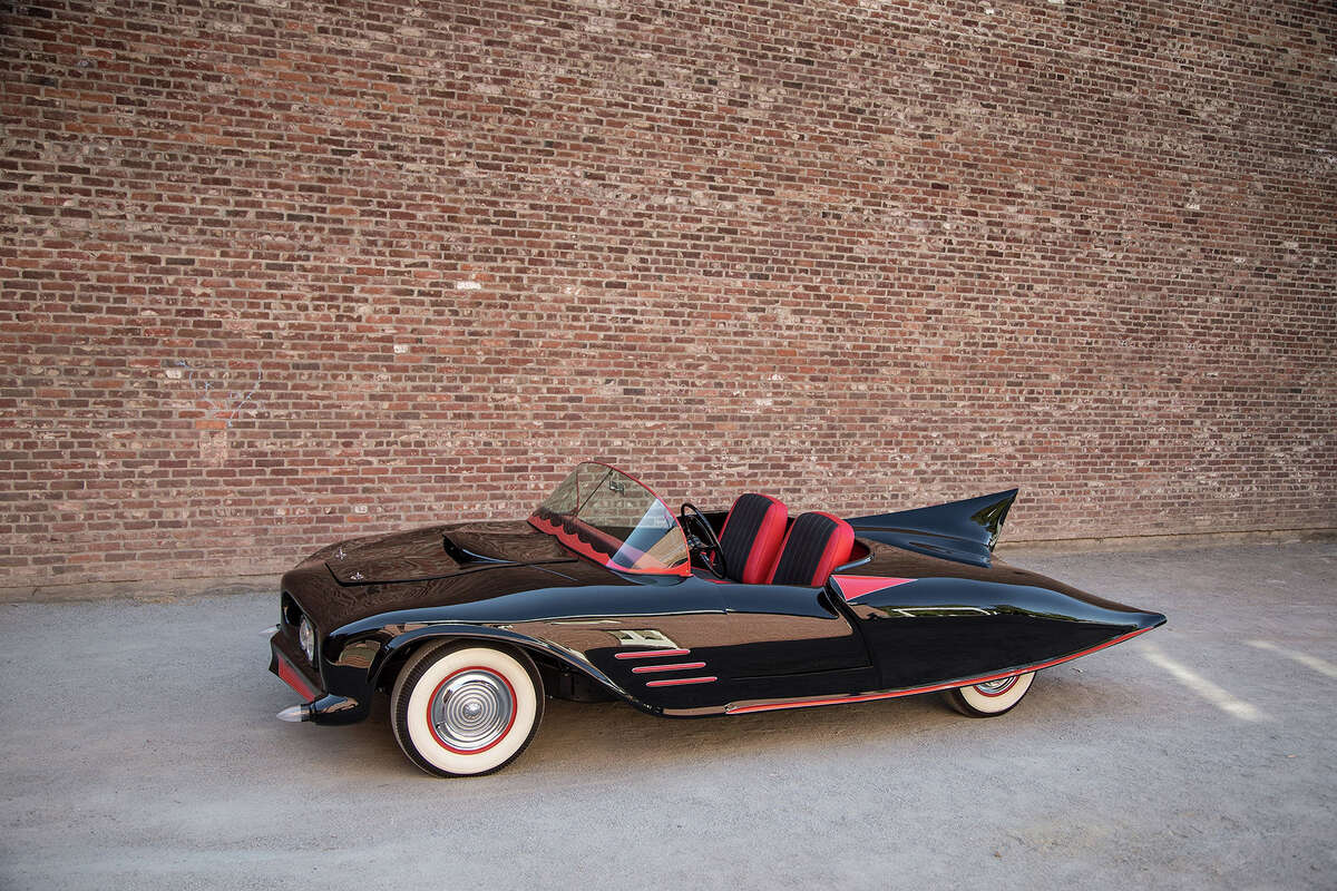 What is believed to be the world's first car that became an officially licensed Batmobile was conceived and customized starting in 1960 by 23-year-old Forrest Robinson. Robinson completed the car in 1963-two years before the George Barris customization of the TV Batmobile was started.