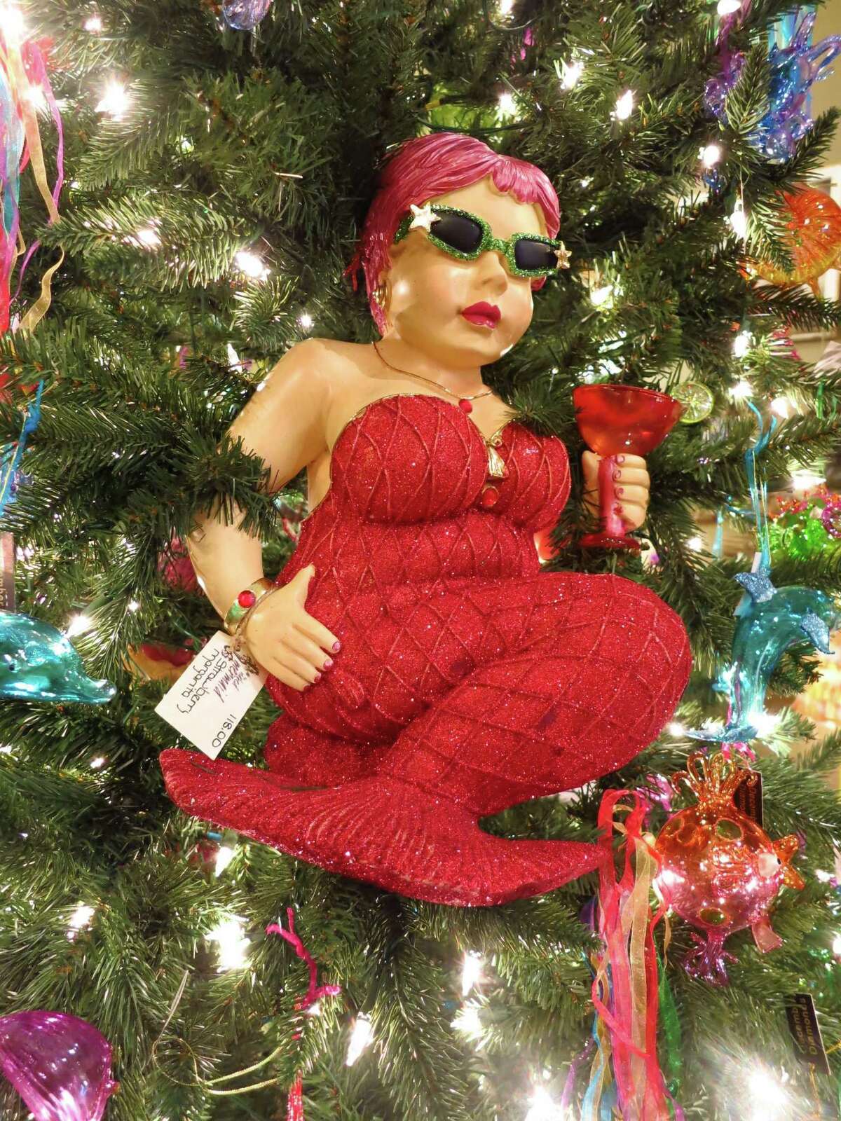 The shop is called The Naked Mermaid, but this mermaid tree ornament comes all decked out in holiday finery in Galveston.