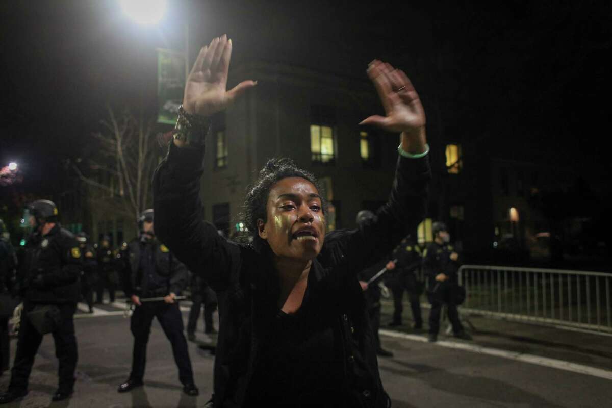 Demonstrators march in Berkeley, California on Saturday, December 6, 2014. Demonstrators were responding to the grand jury verdicts in the shooting death of Michael Brown in Ferguson, Missouri and the chokehold death of Eric Garner in New York City by local police officers in their communities.