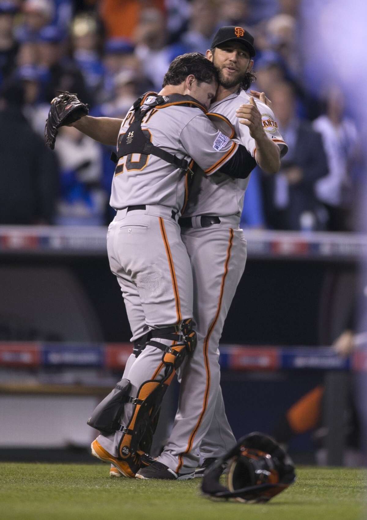 Giants Buster Posey hugs Madison Bumgarner as the Giants defeated the Royals in Game 7 of the World Series at Kauffman Stadium on Wednesday, Oct. 29, 2014 in Kansas City, Mo.