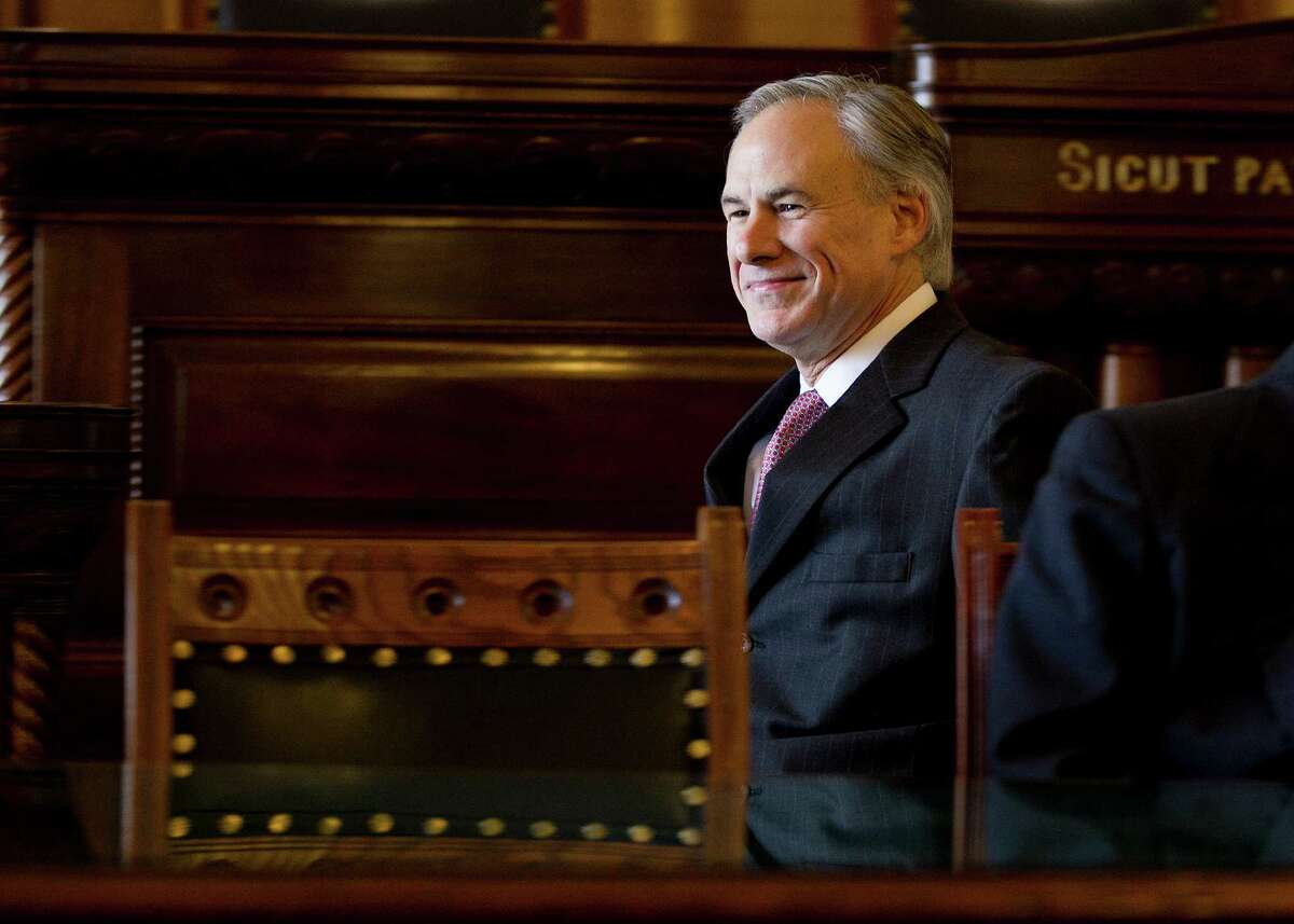Texas Gov.-elect Greg Abbott makes his way into the room to announce key staff positions and outline his priorities for the upcoming legislative session during a news conference at the Capitol in Austin, Texas, Monday, Dec.8 2014. (AP Photo/Austin American-Statesman, Deborah Cannon)