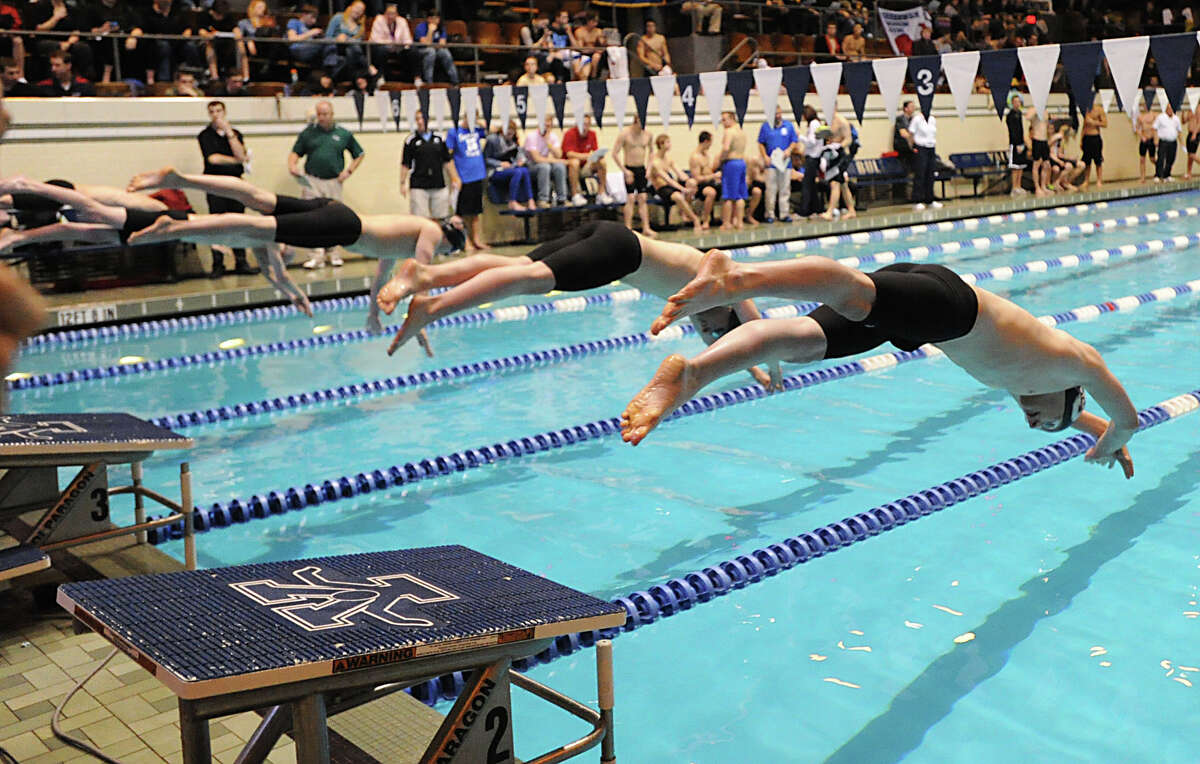 At right, Dan Williams of Staples competes in the 500 freestyle event during the State Open swimming championships at Yale University, New Haven, Conn., Saturday, March 16, 2013.