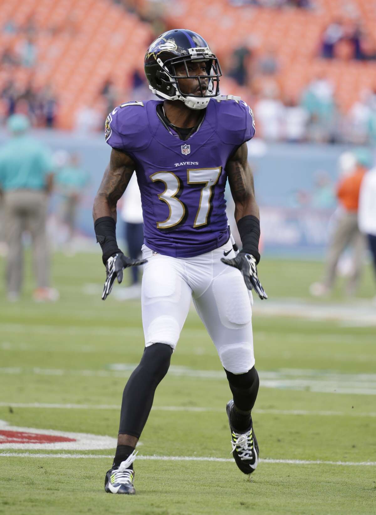 Baltimore Ravens defensive back Danny Gorrer (37) warms up before an NFL football game against the Miami Dolphins, Sunday, Dec. 7, 2014, in Miami Gardens, Fla. (AP Photo/Lynne Sladky)