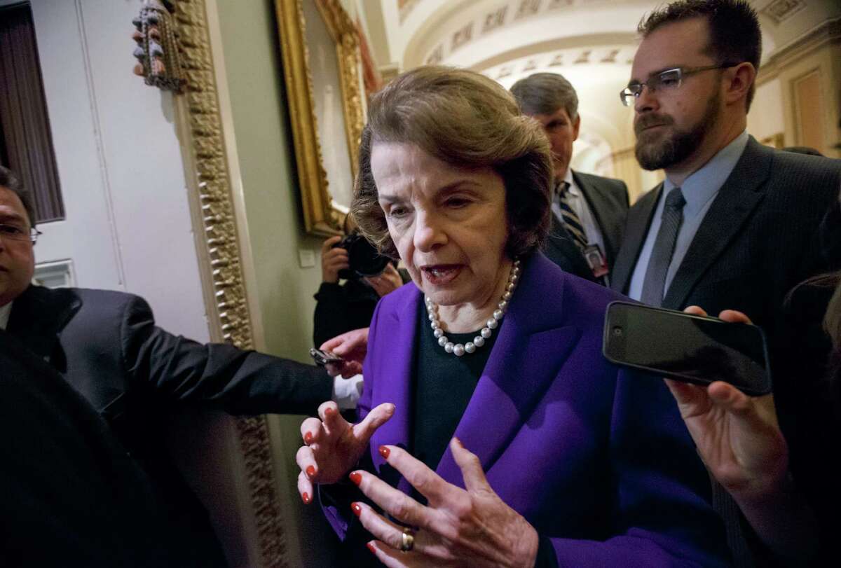 Sen. Dianne Feinstein, D-Calif., chairwoman of the Senate Intelligence Committee, leaves the chamber after releasing a report on the CIA's harsh interrogation techniques at secret overseas facilities after the 9/11 terror attacks, at the Capitol in Washington, Tuesday, Dec. 9, 2014. Feinstein branded the findings a "stain on the nation's history." (AP Photo/J. Scott Applewhite)