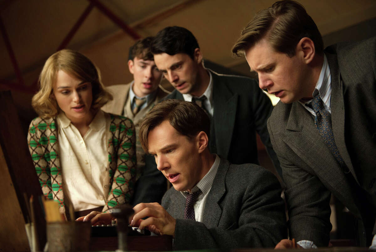 Keira Knightley (left), Matthew Beard, Matthew Goode, Benedict Cumberbatch (seated) and Allen Leech work on breaking the Nazis’ Engima code in “The Imitation Game."