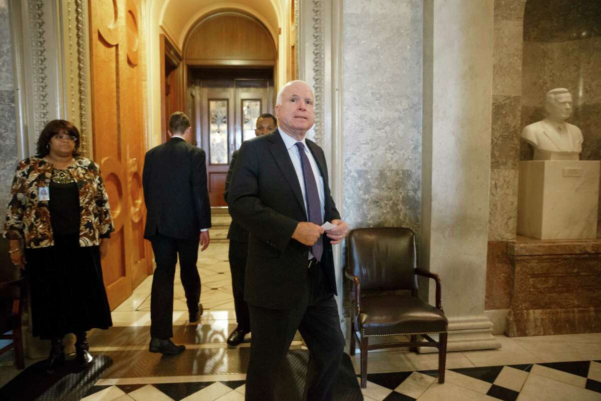 Sen. John McCain, R-Ariz., who's poised to become chairman of the Senate Armed Services Committee, leaves the chamber after he joined Sen. Dianne Feinstein, D-Calif., chairwoman of the Senate Intelligence Committee, to support the release of a report on the CIA's harsh interrogation techniques at secret overseas facilities after the 9/11 terror attacks, at the Capitol in Washington, Tuesday, Dec. 9, 2014. Some Republican leaders objected to the report's release and challenged its contention that harsh tactics didn't work, but McCain, tortured in Vietnam as a prisoner of war, welcomed the report and endorsed its findings. (AP Photo/J. Scott Applewhite)