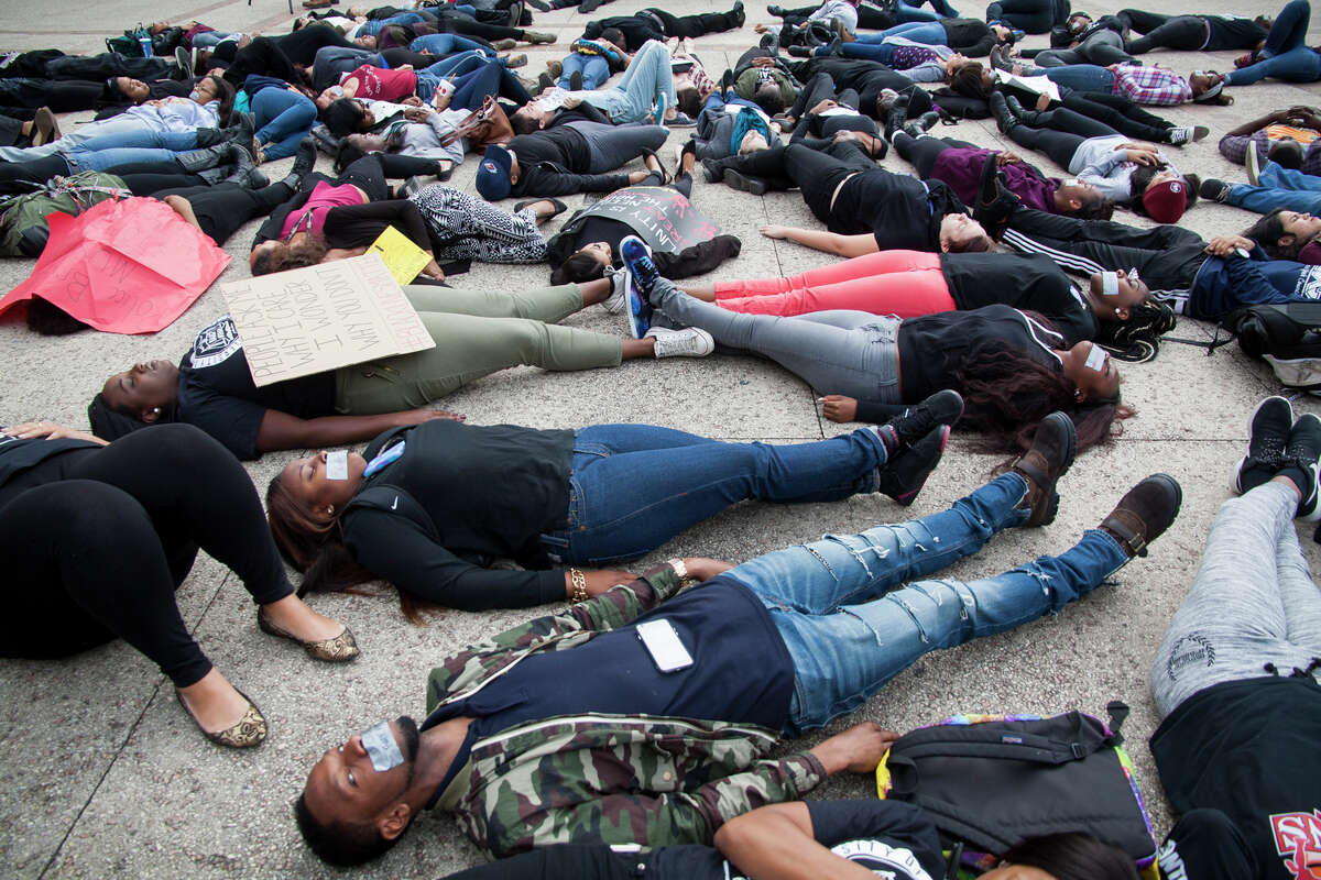 About eighty UTSA students gathered at Sombrilla Plaza Wednesday Dec. 10, 2014 for a "Die-in" in honor of Michael Brown and Eric Garner, where they laid for 15 and half minutes. The event was sponsored by the UTSA NAACP chapter in an effort to shed light on police brutality and injustice.