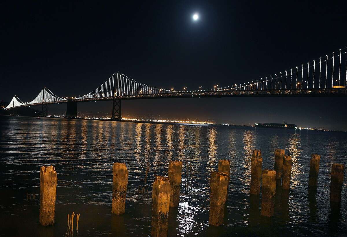 The Bay Lights seen on the Embarcadero at Howard St. in San Francisco, California, on Friday, November 15, 2013. The Bay Bridge will host the light sculpture, designed by artist Leo Villareal until March of 2015.
