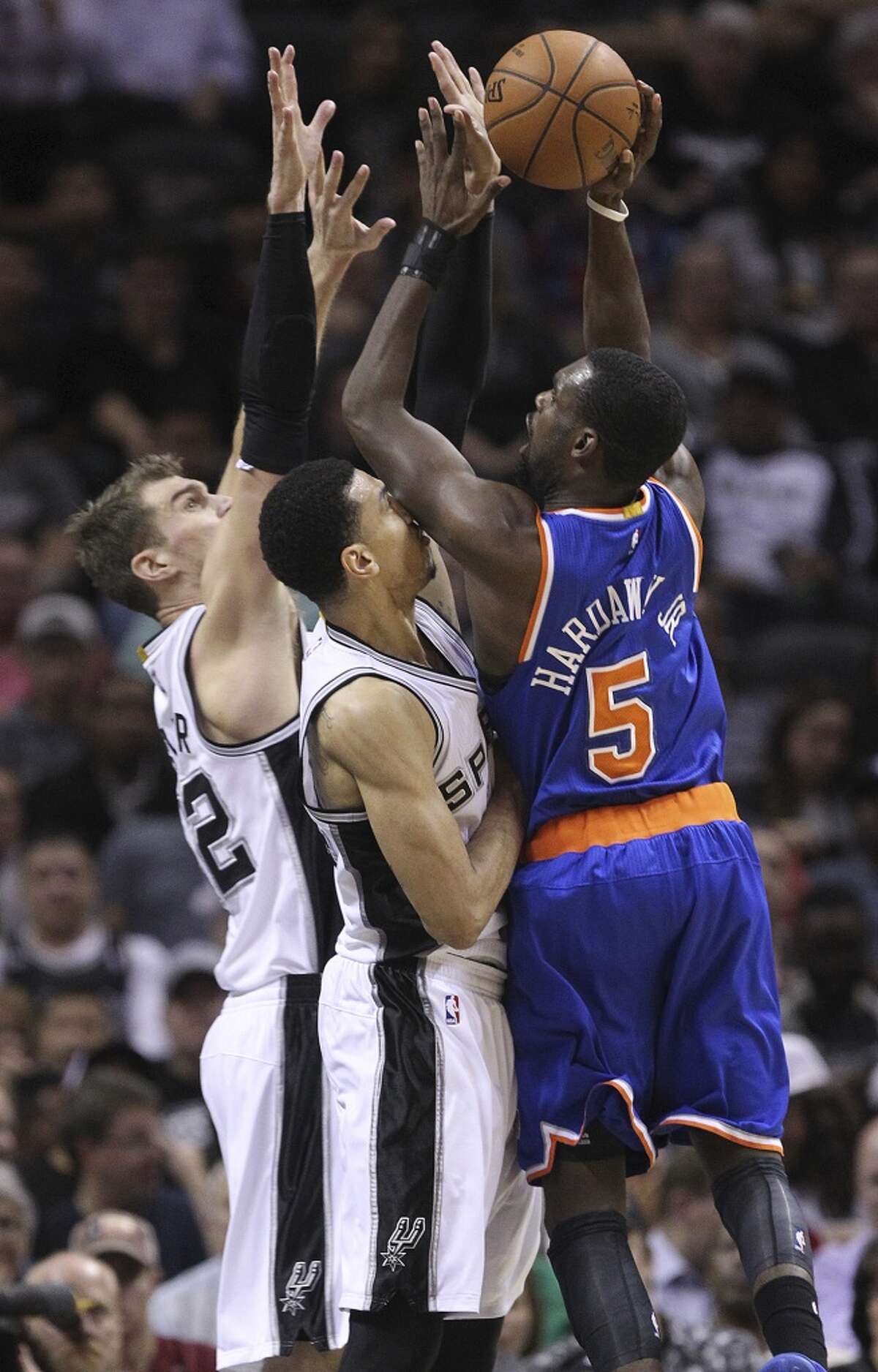 San Antonio Spurs' Danny Green and Tiago Splitter put pressure on New York Knicks' Tim Hardaway Jr. during the second half at the AT&T Center, Wednesday, Dec. 10, 2014. The Spurs won 109-95.