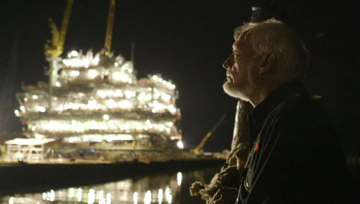 Latham Smith looks out at an oil rig at night in "The Great Invisible," a documentary on the Deepwater Horizon oil-rig explosion as seen through the eyes of oil executives, survivors and Gulf Coast residents who experienced it first hand.