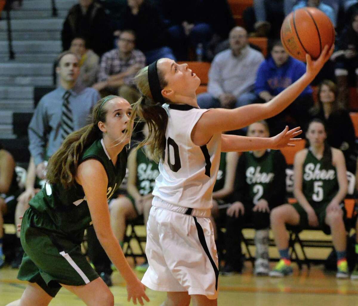Bethlehem's #30 Emily Wander, right, gets past Shen's #32 Carly Boland on her way to the basket during Friday's game at Bethlehem High Dec. 12, 2014, in Delmar, NY. (John Carl D'Annibale / Times Union)