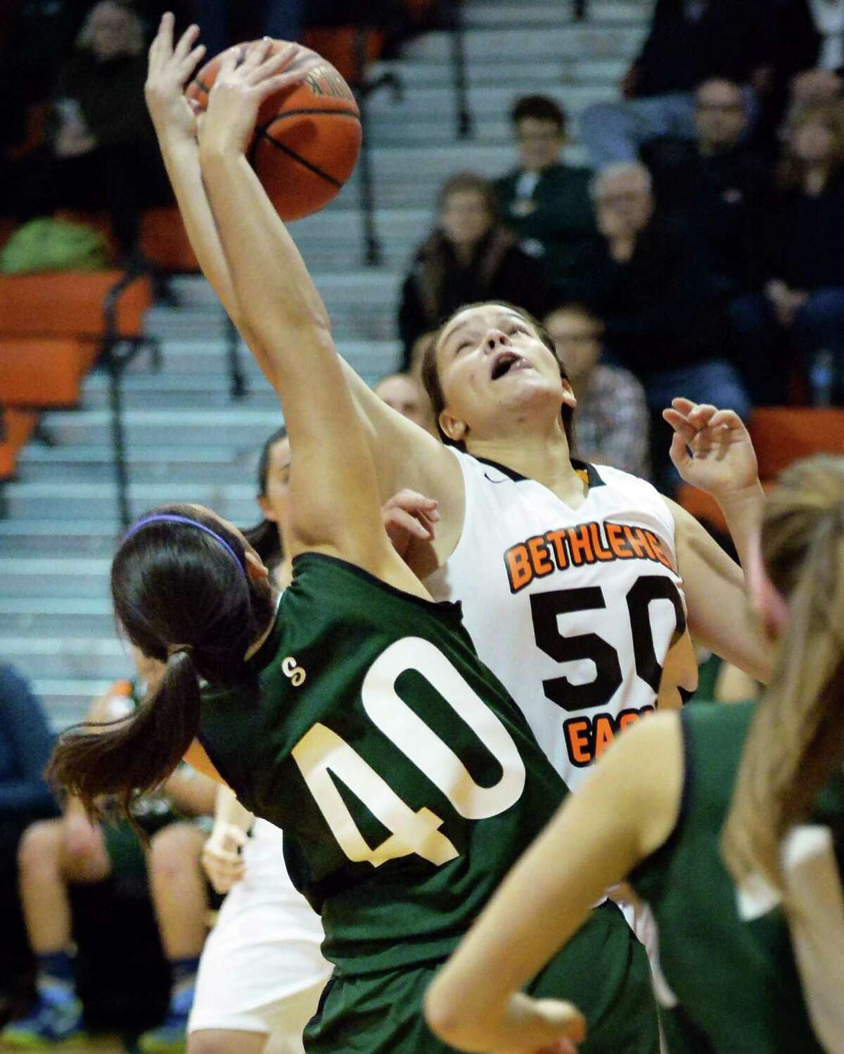 Bethlehem's #50 Erin O'Donnell, right, and Shen's #40 Victoria Pardi fight for a rebound during Friday's game at Bethlehem High Dec. 12, 2014, in Delmar, NY. (John Carl D'Annibale / Times Union)