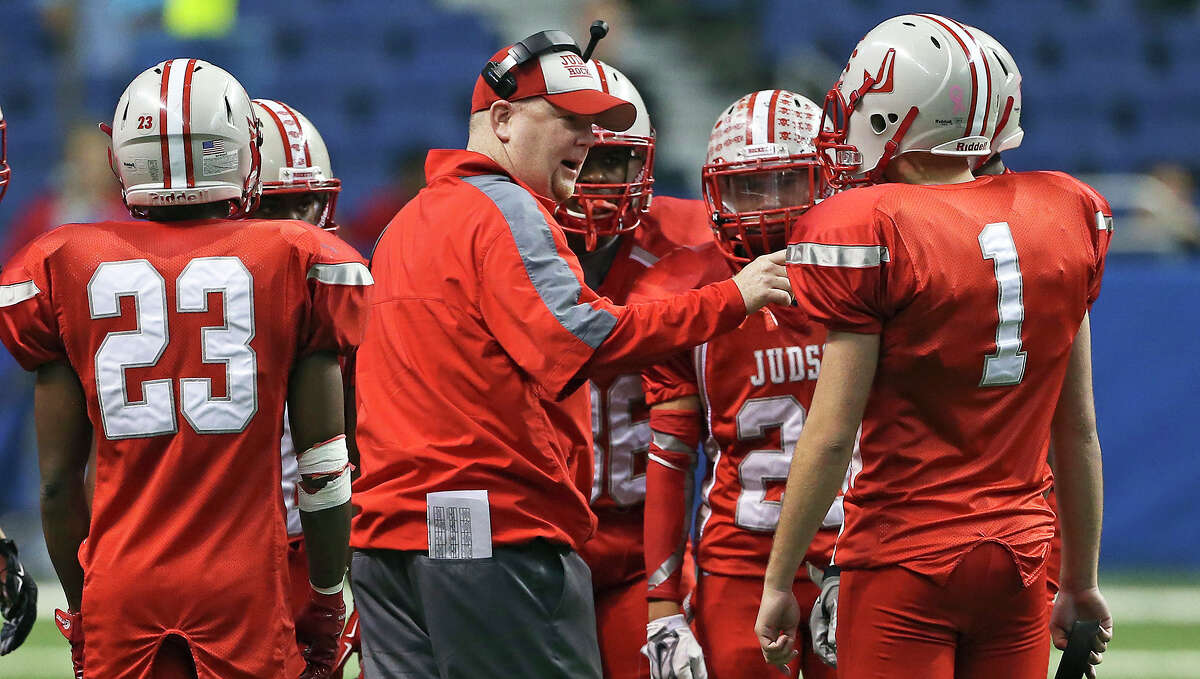 Rockets head coach Sean McAuliffe gathers his players during a time out as Judson hosts Cypress Ranch in 6A Division I semifinal action at the Alamodome on Dec. 13, 2014.