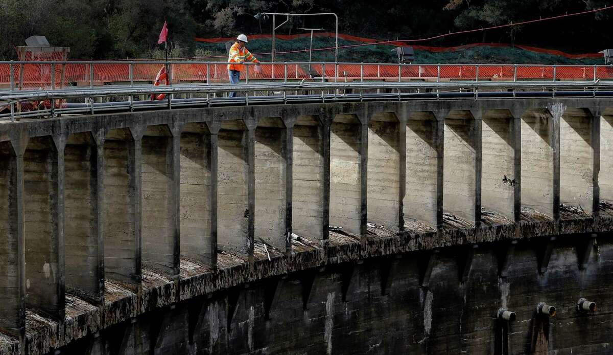 Project manager Aman Gonzalez, with California American Water looks out from the 106-foot-tall San Clemente Dam at the halfway point of the project to remove the dam and divert the Carmel River, near Carmel Valley Village, Calif., as seen on Wednesday Dec. 10, 2014.