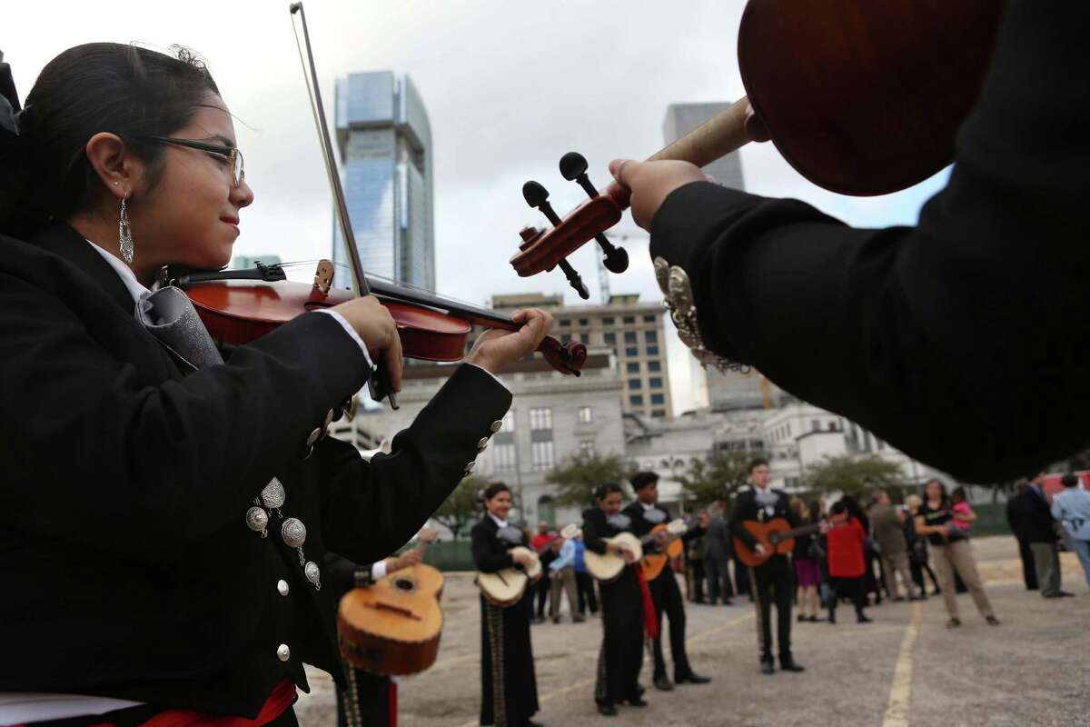 Bianca Lozano and the HSPVA student Mariachi group performs at the new site for the arts campus. ﻿