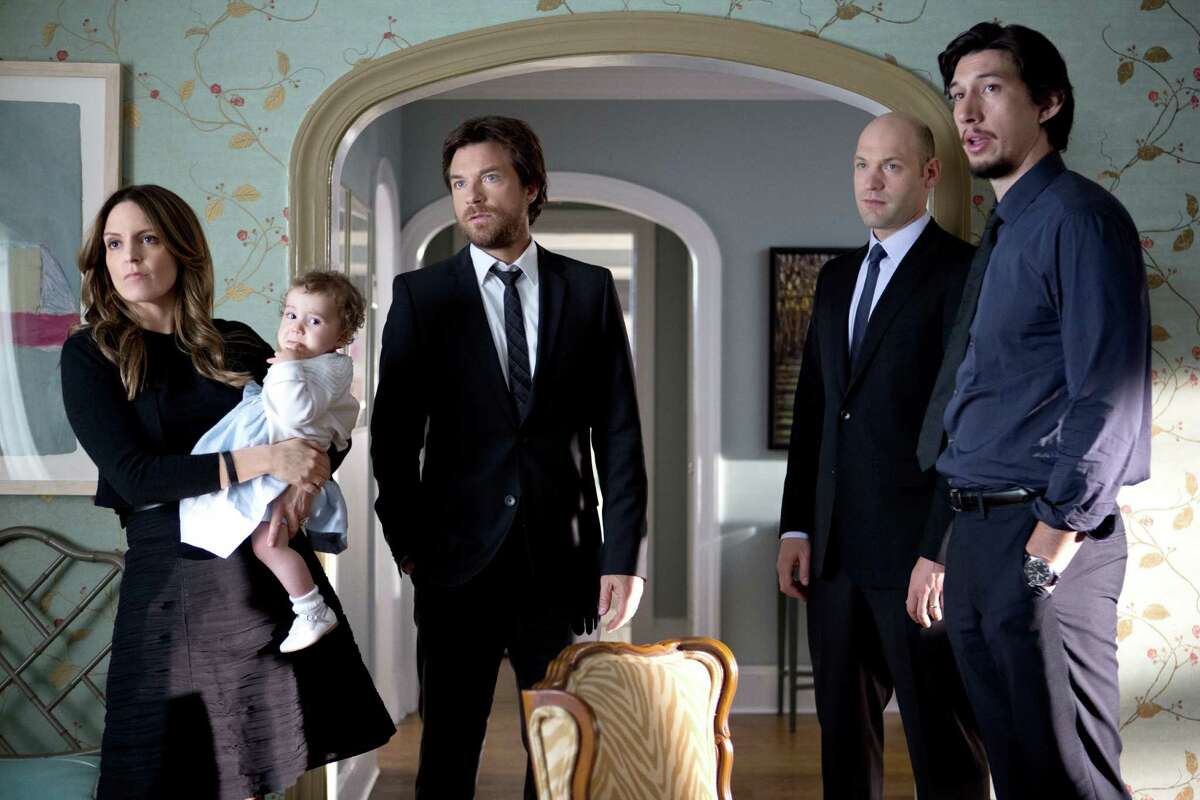 This photo released by Warner Bros. Pictures shows, from left, Tina Fey as Wendy Altman, Jason Bateman as Judd Altman, Corey Stoll as Paul Altman, and Adam Driver as Phillip Altman, in a scene from the film, "This Is Where I Leave You." (AP Photo/Warner Bros. Pictures, Jessica Miglio)