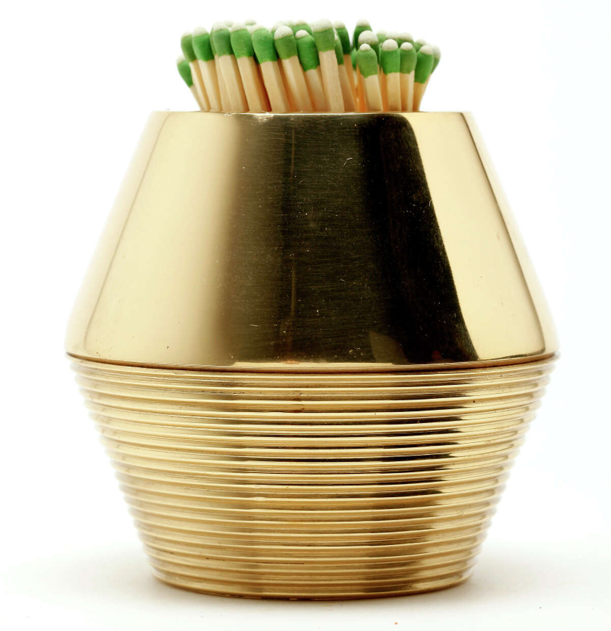 AERIN tapered cone match strike in brass works with strike-anywhere matches. $190, www.aerin.com