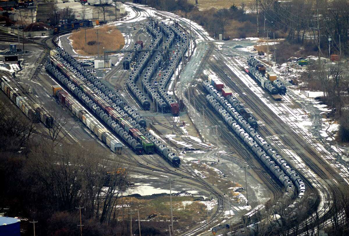 Oil tanker and freight cars at the Port of Albany are seen from Corning Tower Monday afternoon, Dec. 15, 2014, in Albany, N.Y. Speed limits for trains were lowered on tracks near a large industrial park near Voorheesville that are commonly used by massive trains carrying flammable crude oil after state and federal safety inspectors found a faulty switch that could have caused a derailment. (Will Waldron/Times Union)