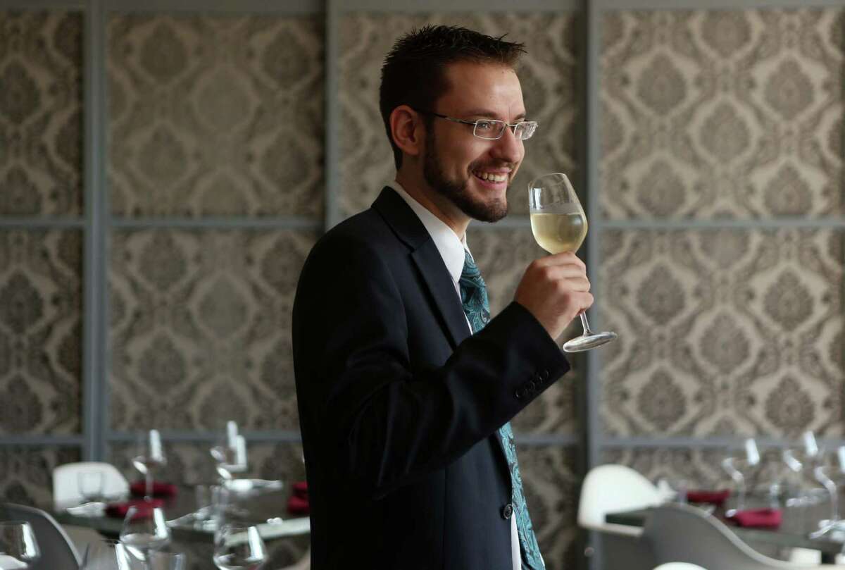 L'Olivier somm Sebastien Laval with his wine of choice on Tuesday, Dec. 9, 2014, in Houston. ( Mayra Beltran / Houston Chronicle )