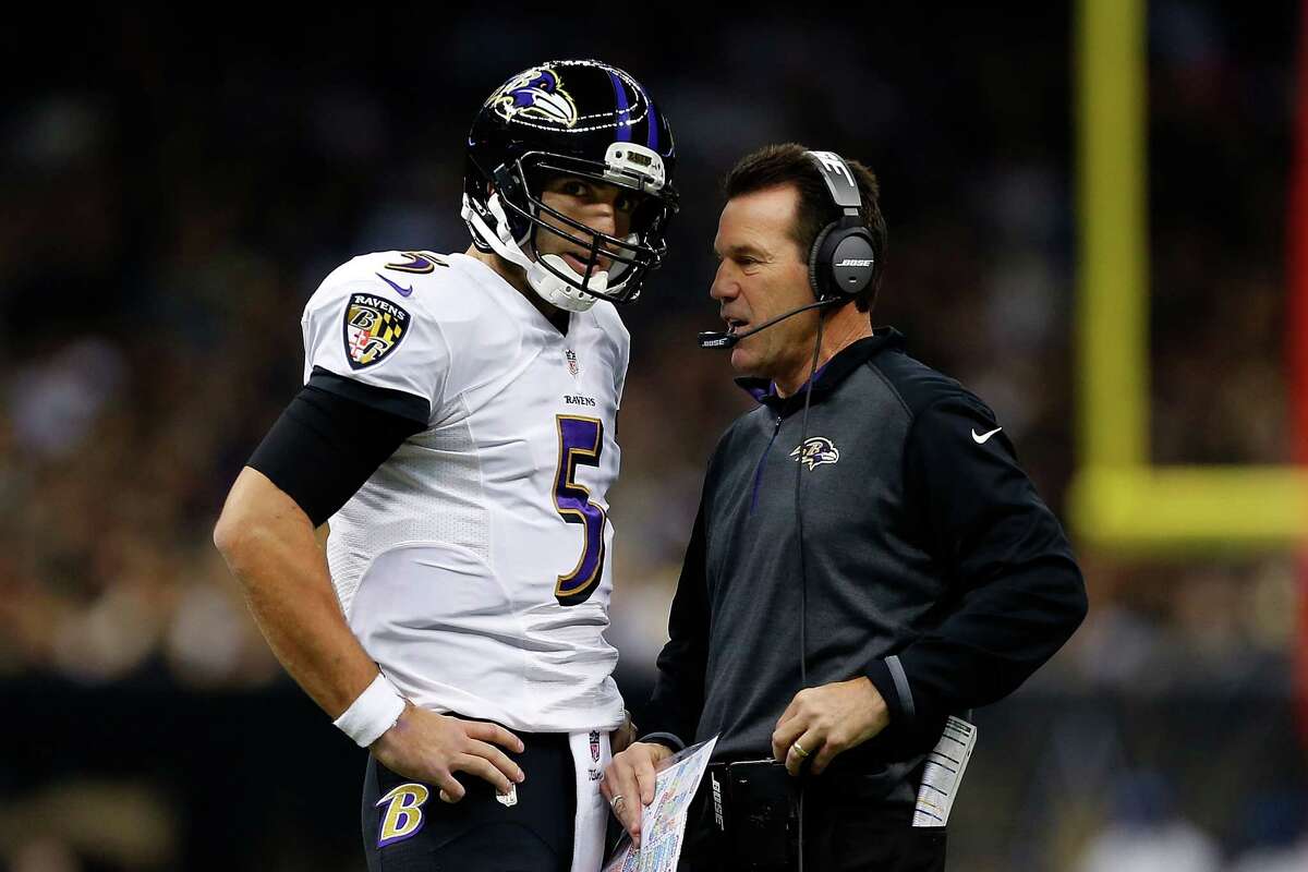 Ravens quarterback Joe Flacco speaks with offensive coordinator Gary Kubiak during the first quarter against the New Orleans Saints at the Mercedes-Benz Superdome on Nov. 24.