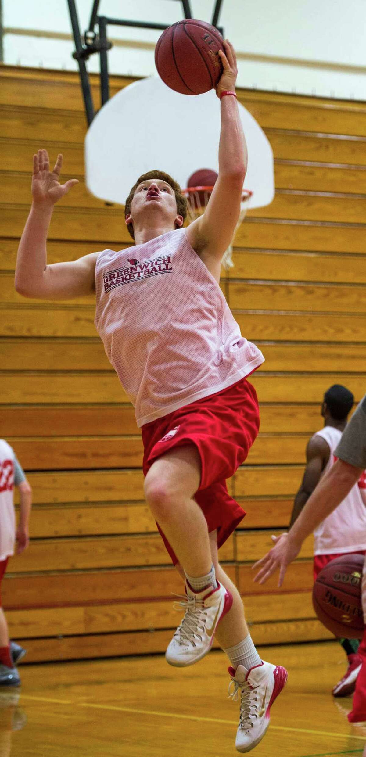 Greenwich high schoolâÄôs Griffin Golden going up for a layup during a boys varsity basketball practice held at Greenwich high school, Greenwich, CT on Tuesday, December 16th, 2014.