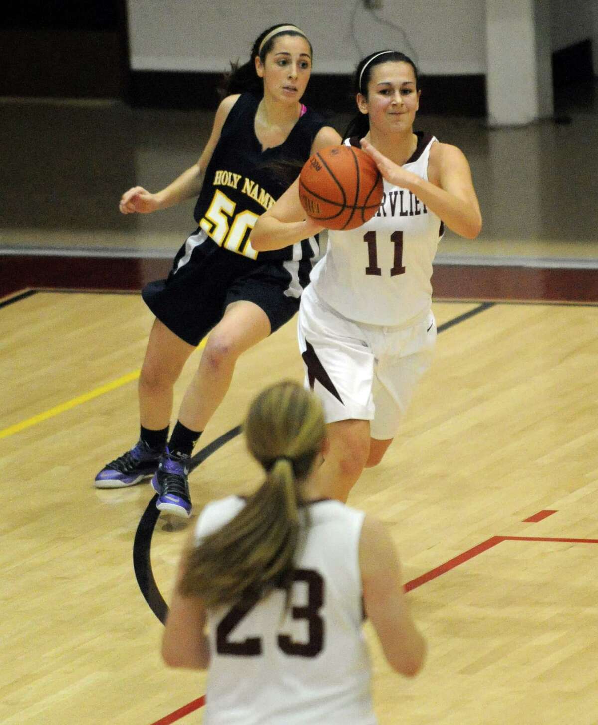 Watervliet's Meghan Capone looks to pass during their high school girl's basketball game against Holy Names on Tuesday Dec. 16, 2014 in Watervliet ,N.Y. (Michael P. Farrell/Times Union)