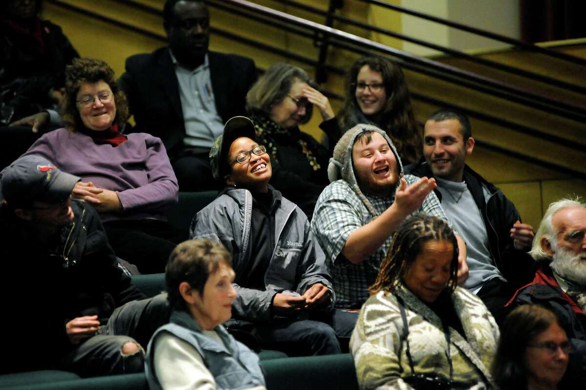 People in the crowd heckle the mayor and members of the board during a Berkeley city council meeting held in Berkeley, CA, on Tuesday, December 16, 2014.