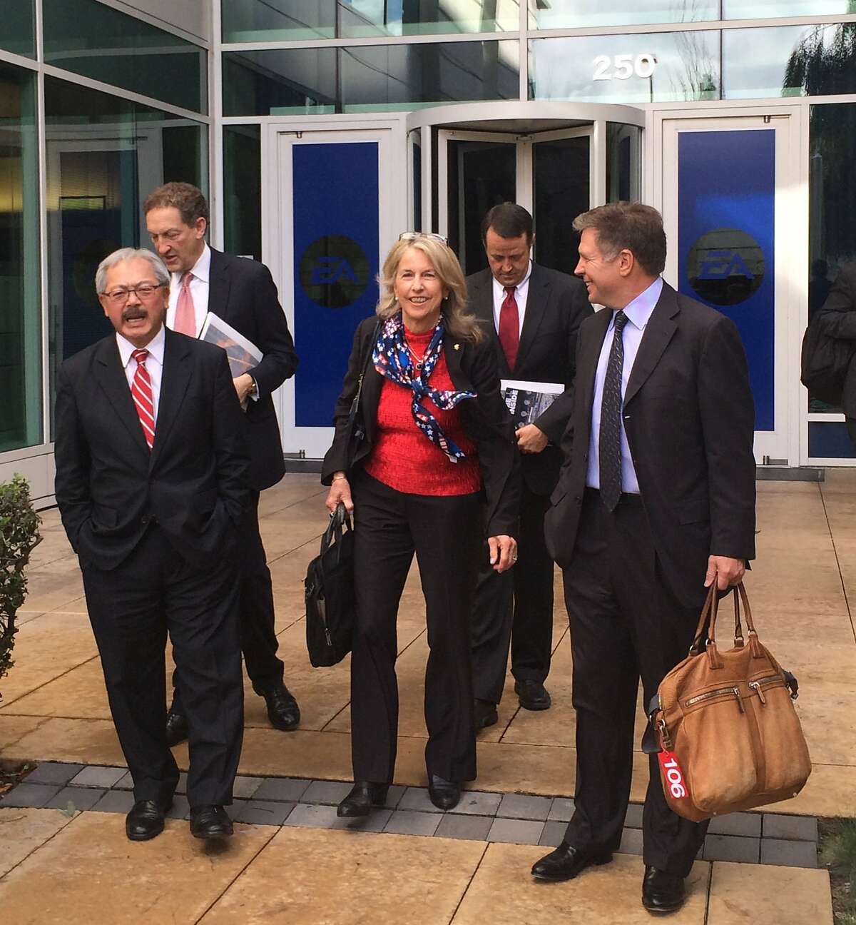 San Francisco's delegation leaves the Electronic Arts office in Redwood City, Calif., on Tuesday, Dec. 16, 2014, after making a presentation to the U.S. Olympic Committee about hosting the 2024 Summer Olympic Games. From left to right, San Francisco Mayor Ed Lee, Giants President and CEO Larry Baer, Olympic gold medal swimmer Anne Warner Cribbs, Populous senior principal Jerry Anderson, and venture capitalist Steve Strandberg. San Francisco is competing against Los Angeles, Boston and Washington D.C. to be the U.S. contender against an international field.
