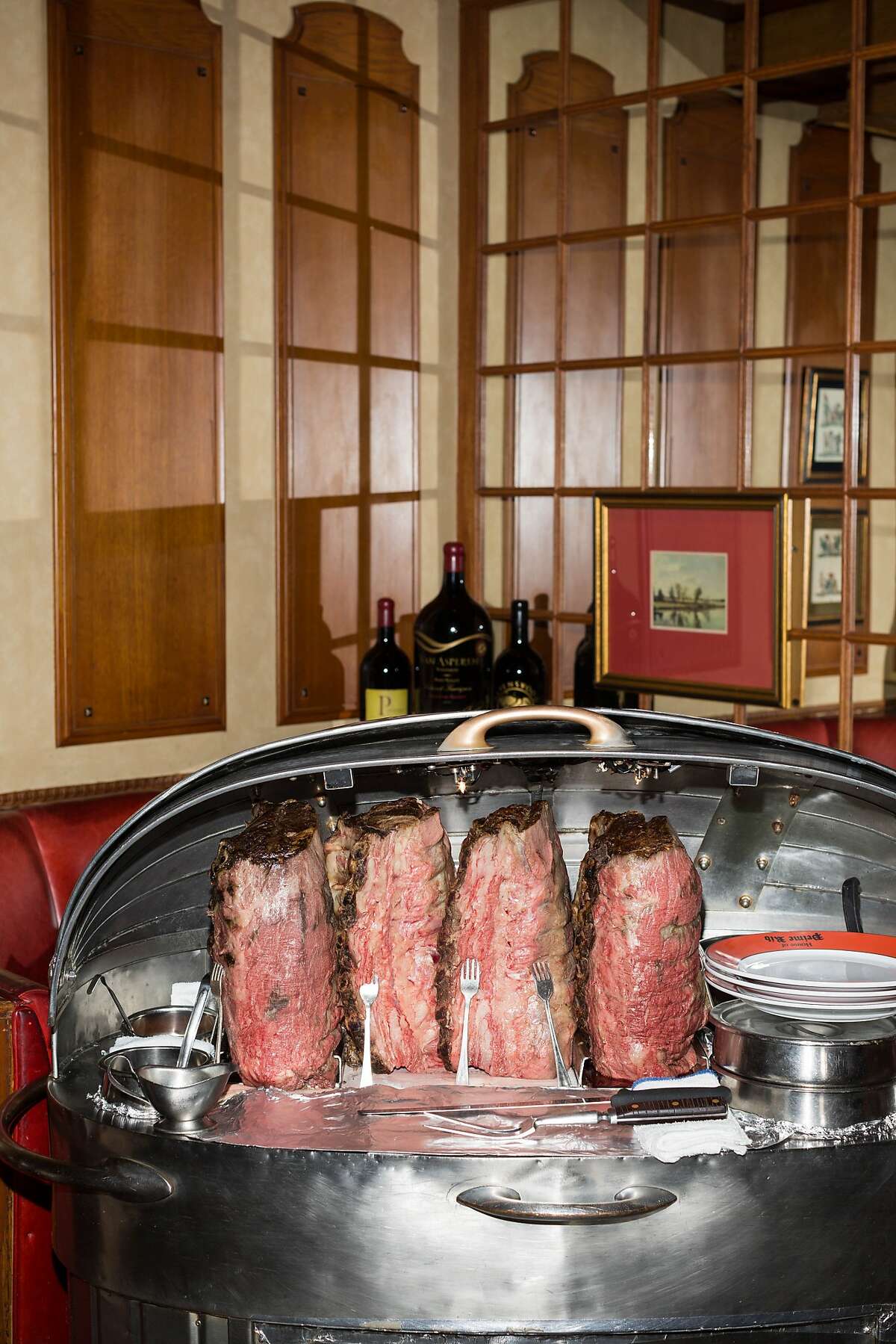 Prime Rib is served on metal carts wheeled through the restaurant and sliced table side at House of Prime Rib in San Francisco, Calif., Monday, November 17, 2014.