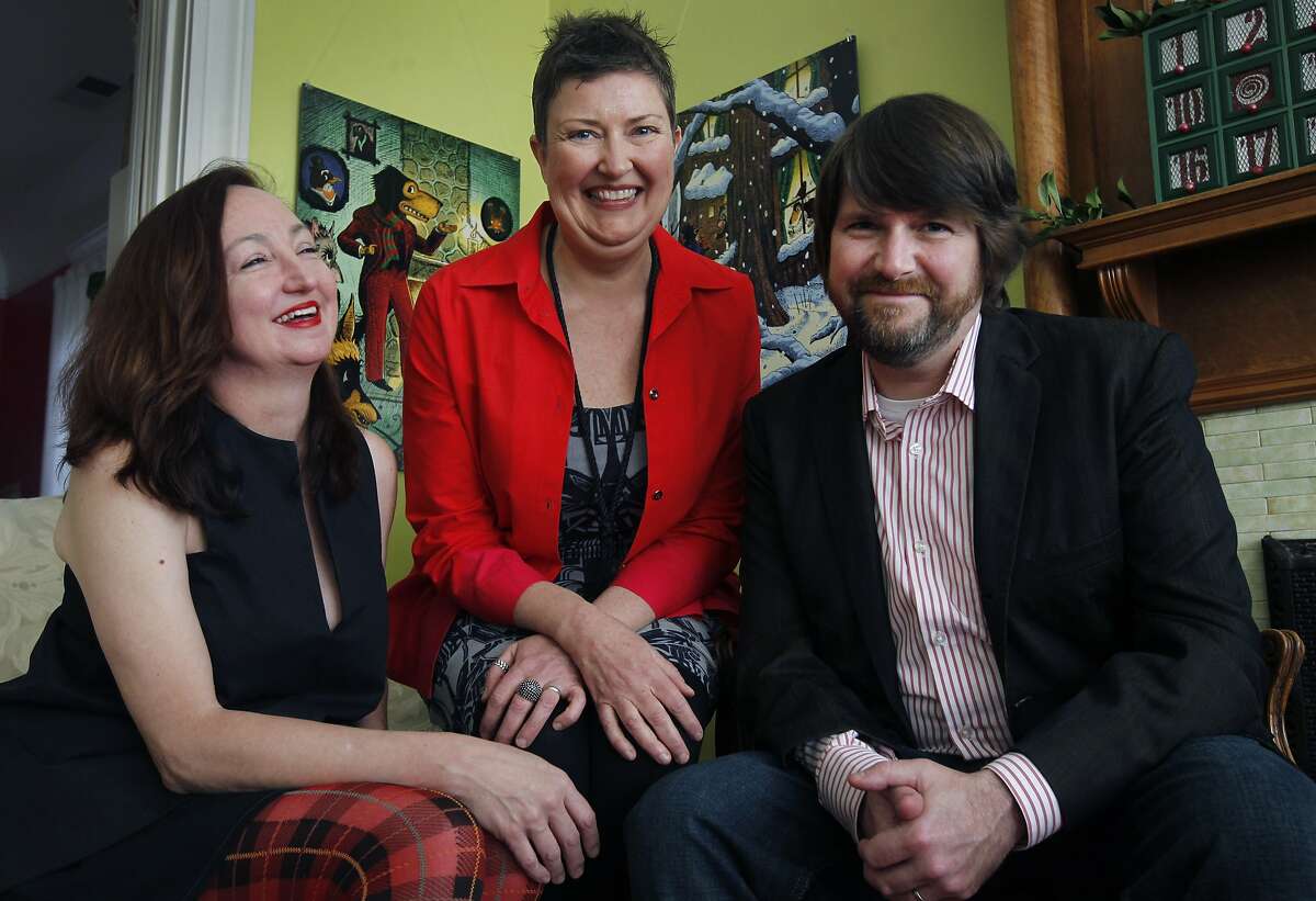 Betsy Cordes (center) is seen at her home studio with designer Cynthia Wigginton and illustrator Adam McCauley in San Francisco, Calif. on Saturday, Dec. 13, 2014. Cordes is republishing a version of "Mr. Dog's Christmas at the Hollow Tree Inn," a classic children's holiday story by Albert Bigelow Paine from 1898.