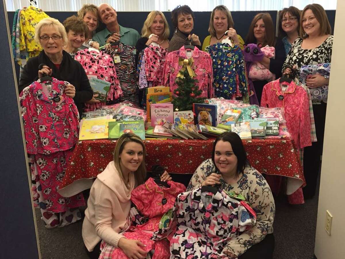 For the past two years, the staff at Rose & Kiernan Insurance Agency in East Greenbush have collected donations for the Christmas Pajama Promise instead of exchanging holiday gifts. (Photo courtesy of Kristin Salvi)