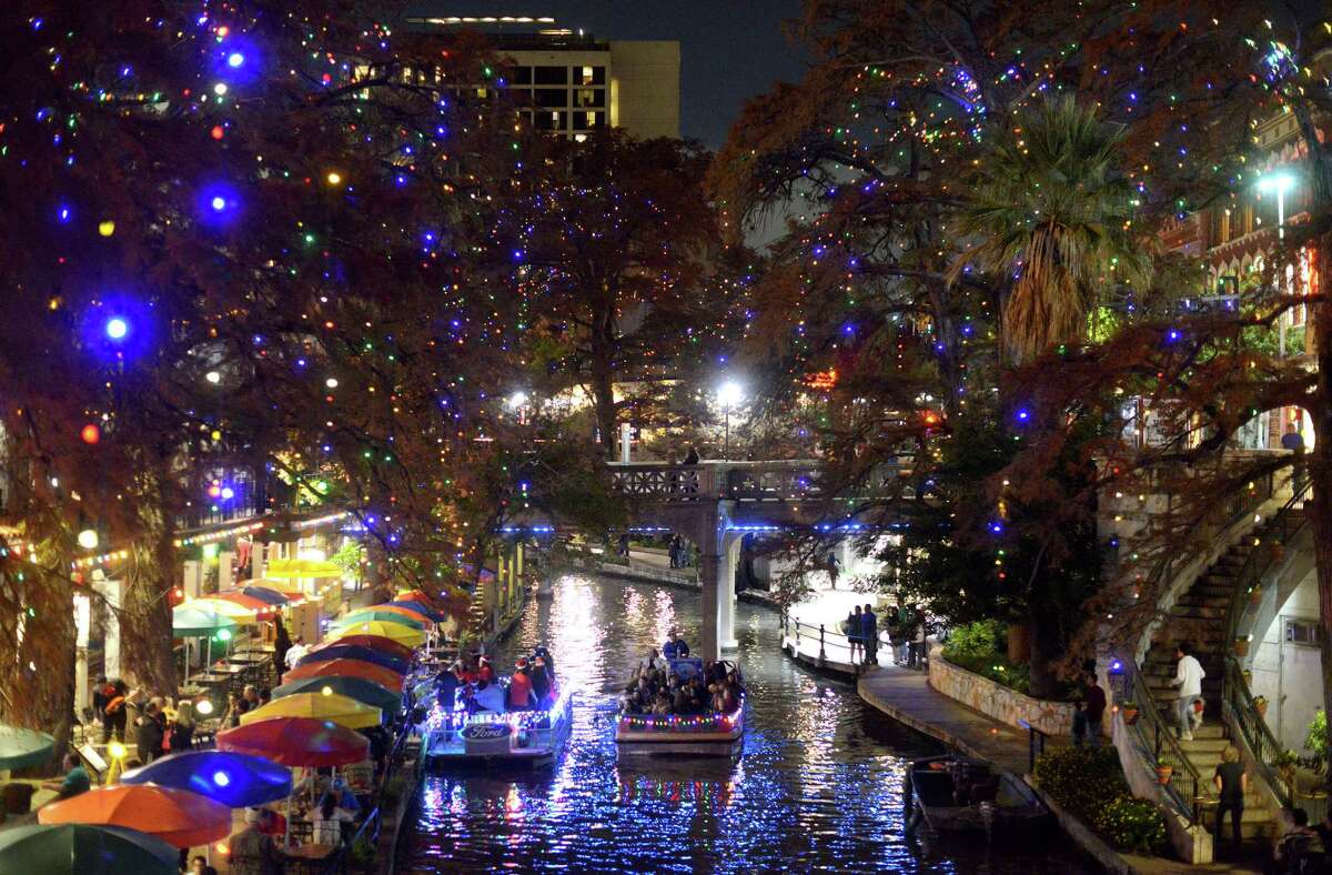 1. Take a River Walk tour by boat during the holiday season The twinkling lights dangling from the century-old trees, reflecting on the waters is one of the most picturesque San Antonio scenes. Be part of the image by riding a river barge while taking in the glowing scenery. 