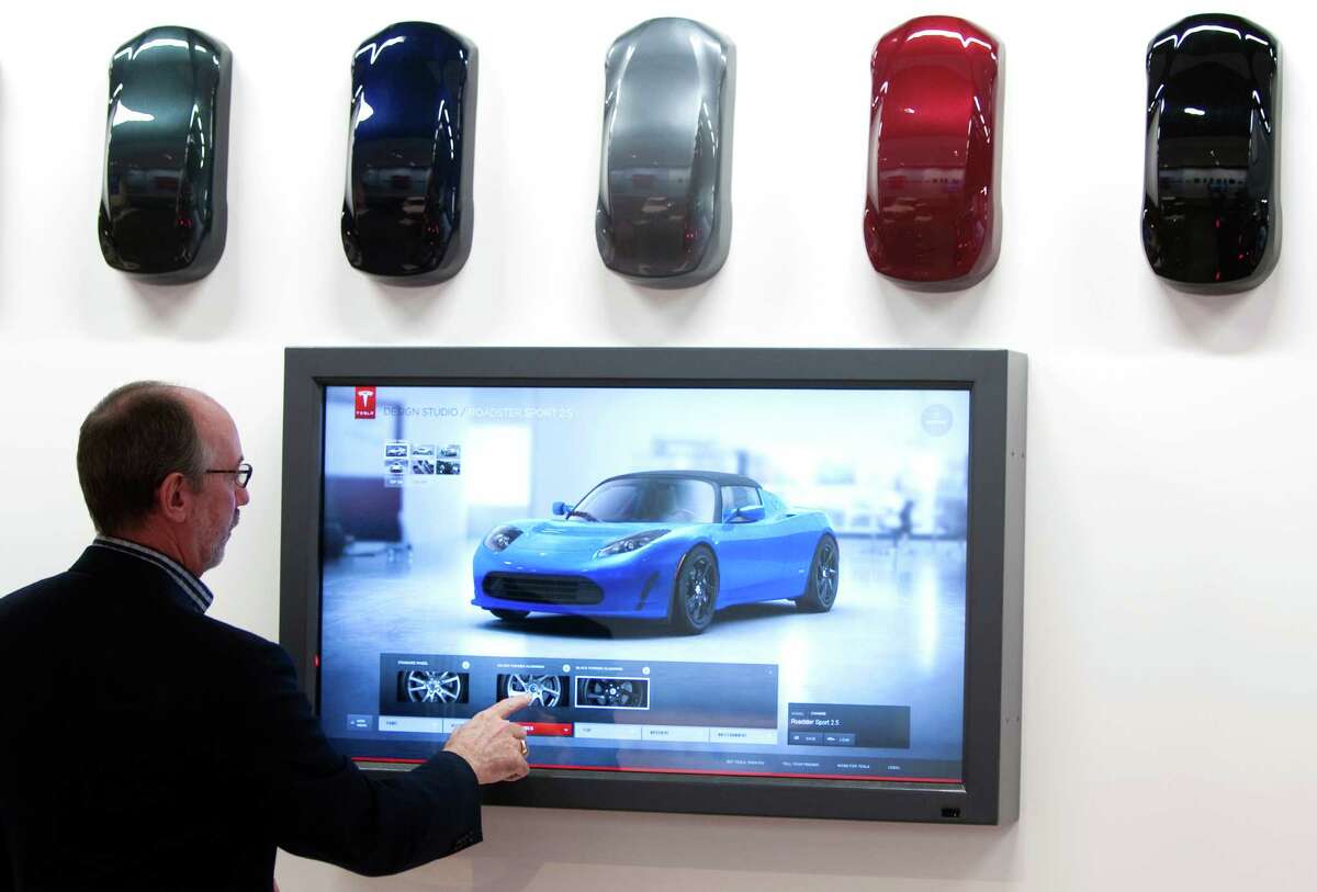 George Blankenship ﻿shows off his company's electric cars at the Tesla Gallery in the Galleria in 2011.