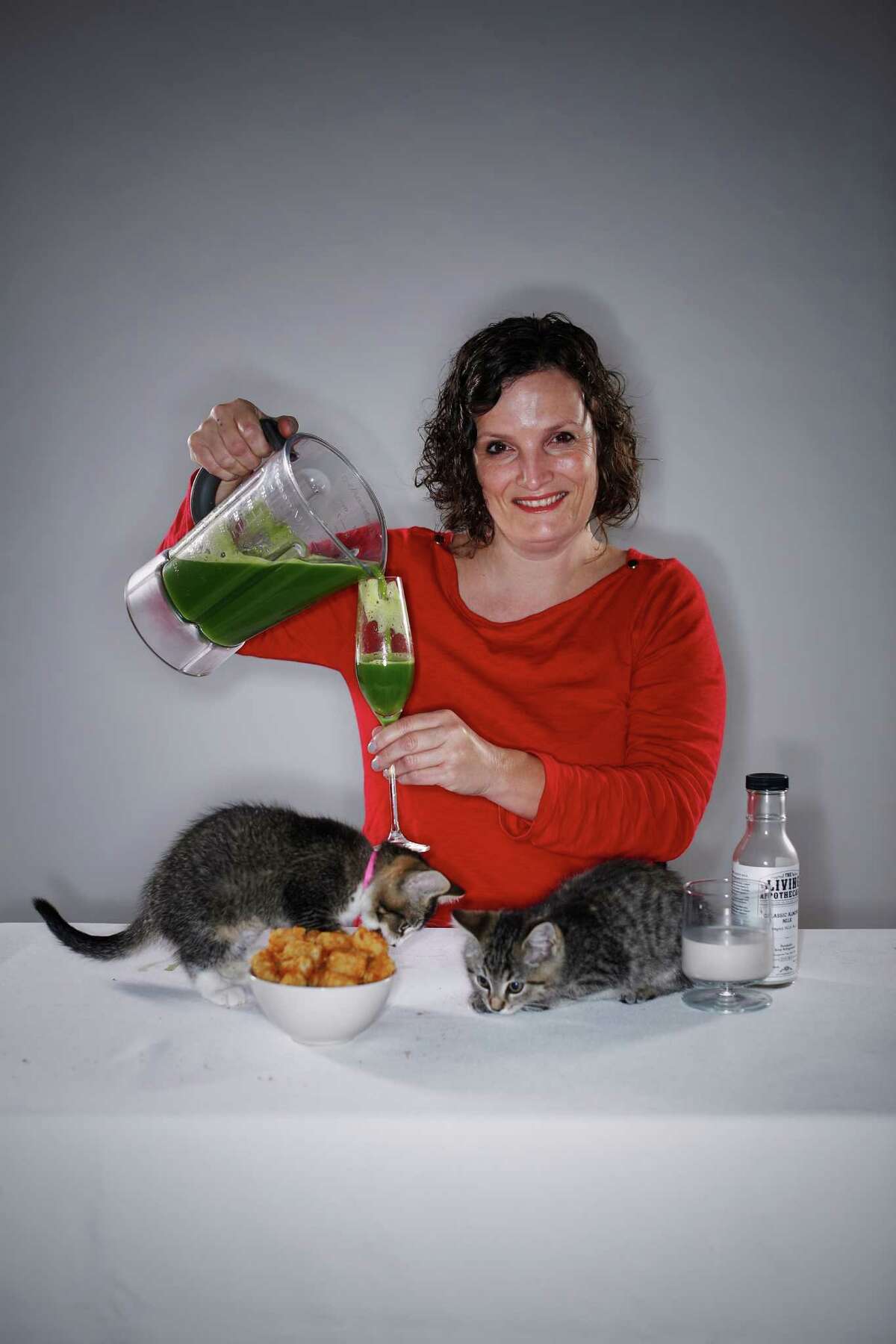 Jennifer Colliau, owner, Small Hand Foods, and bar and cafe manager, the Interval, shows off this year’s food trends. To represent cat cafes, volunteers from the San Francisco SPCA brought 2-month-old Frisbee (left) and Pogo to the photo shoot at The Chronicle. Each year the SPCA helps more than 5,000 animals find loving homes.Learn more and view available animals at www.sfspca.org/adopt.