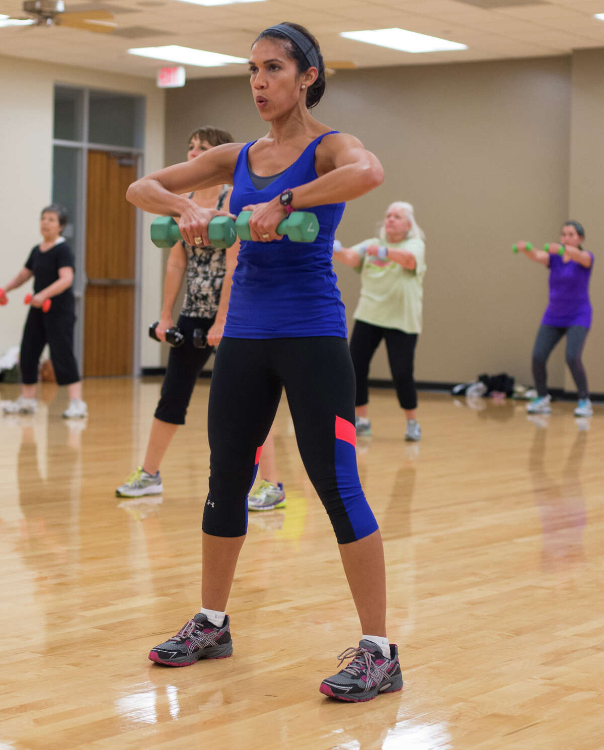 Rachel McNeill during her regular Jazzercise class at the West University Rec Center on Friday, November 14, 2014
