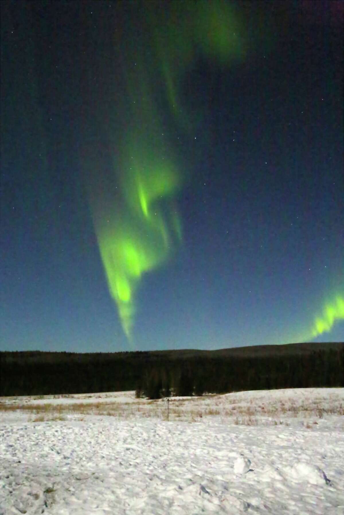 The aurora borealis, or northern lights, appear after midnight in Pleasant Valley, Alaska, not far from the Arctic Circle.